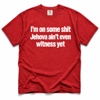 A red short-sleeve crewneck t-shirt with bold white text on the front reading 'I'm on some shit Jehovah ain't even witness yet', displayed flat against a white background.