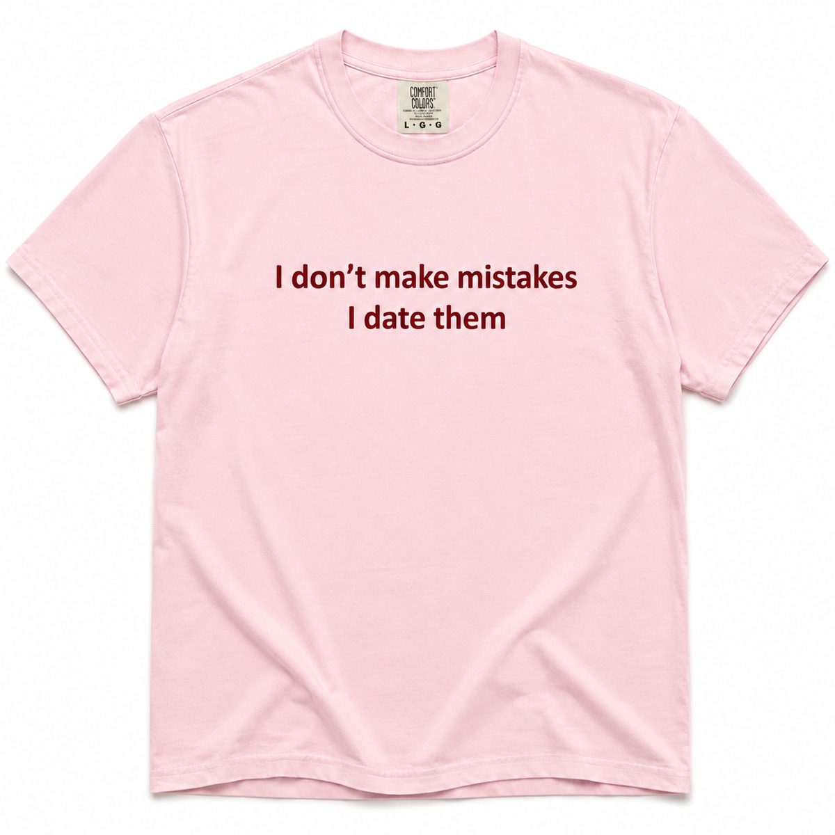 Blossom crewneck T-shirt with dark red “I Don’t Make Mistakes, I Date Them” text printed on the front.