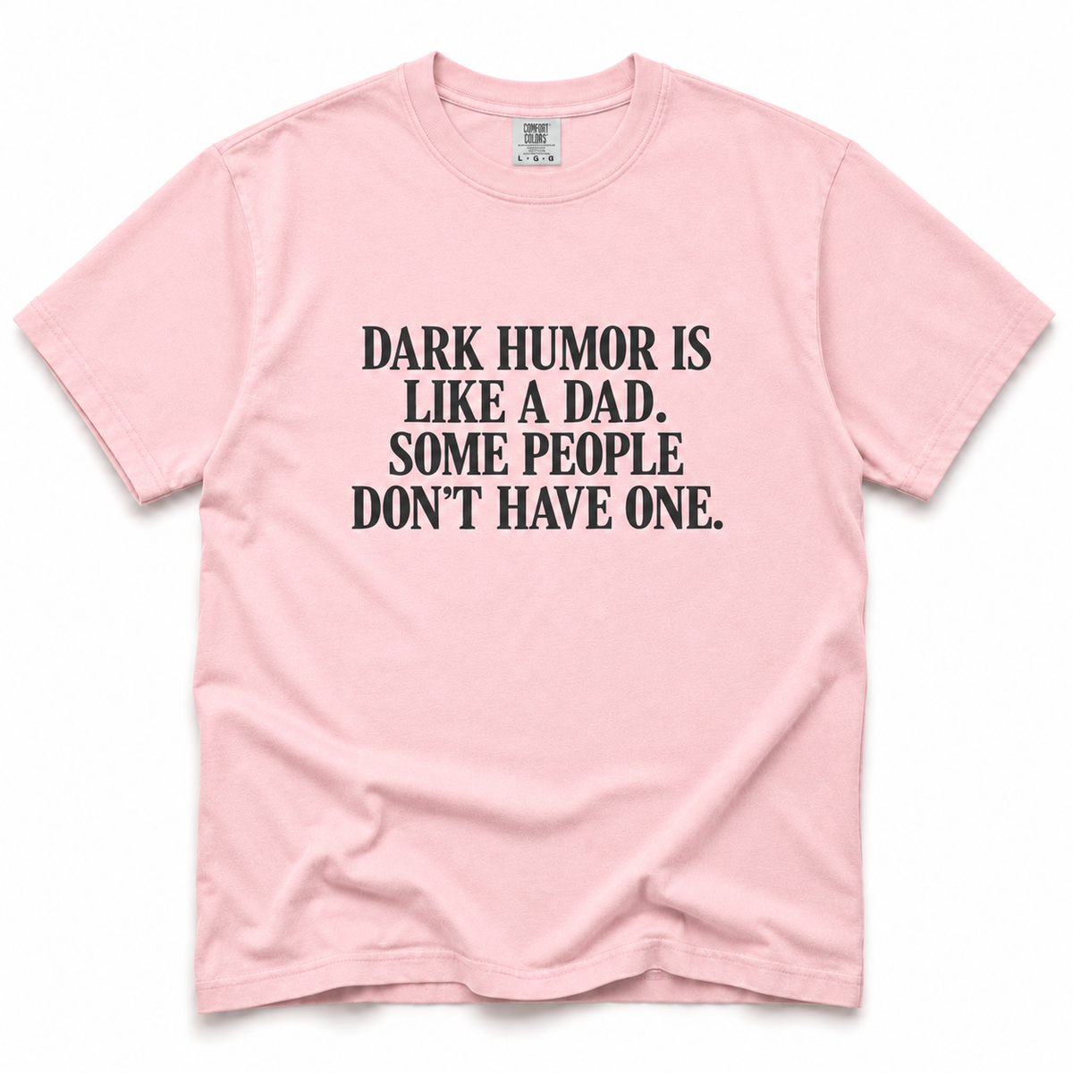 blossom short-sleeve crewneck t-shirt with a black printed text graphic on the front that reads 'DARK HUMOR IS LIKE A DAD. SOME PEOPLE DON'T HAVE ONE.