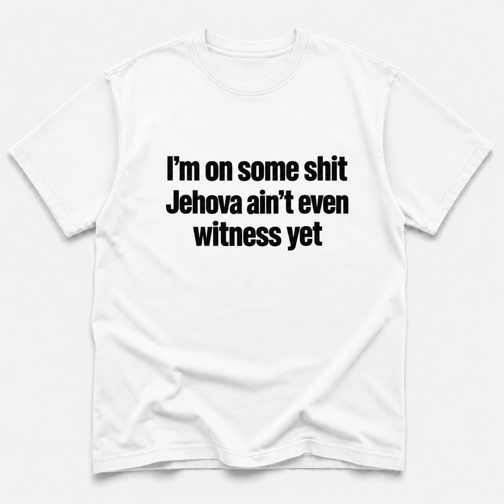A white short-sleeve crewneck t-shirt with bold black text on the front reading 'I'm on some shit Jehovah ain't even witness yet', displayed against a light gray background.
