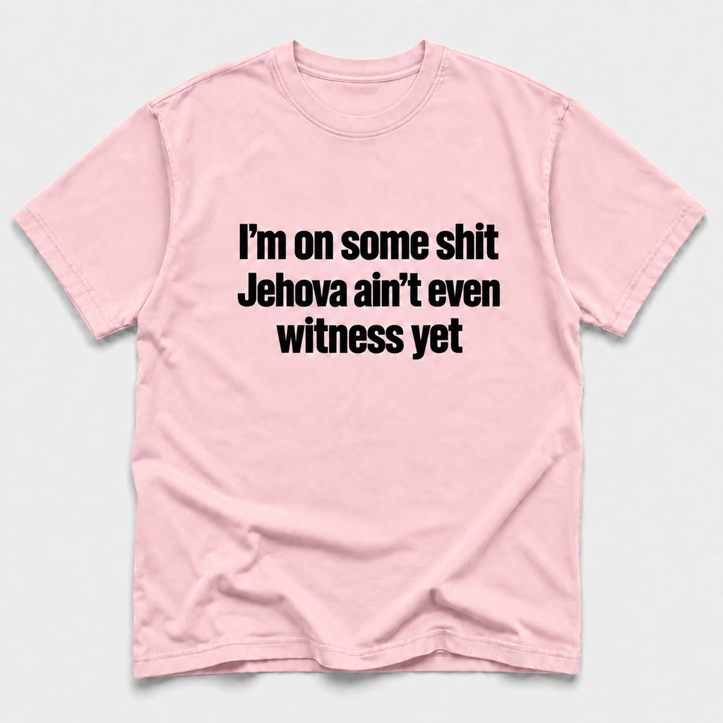 Blossom short-sleeve crewneck T-shirt with bold black text on the front reading “I’m on some shit Jehovah ain’t even witness yet,” displayed flat against a light gray background