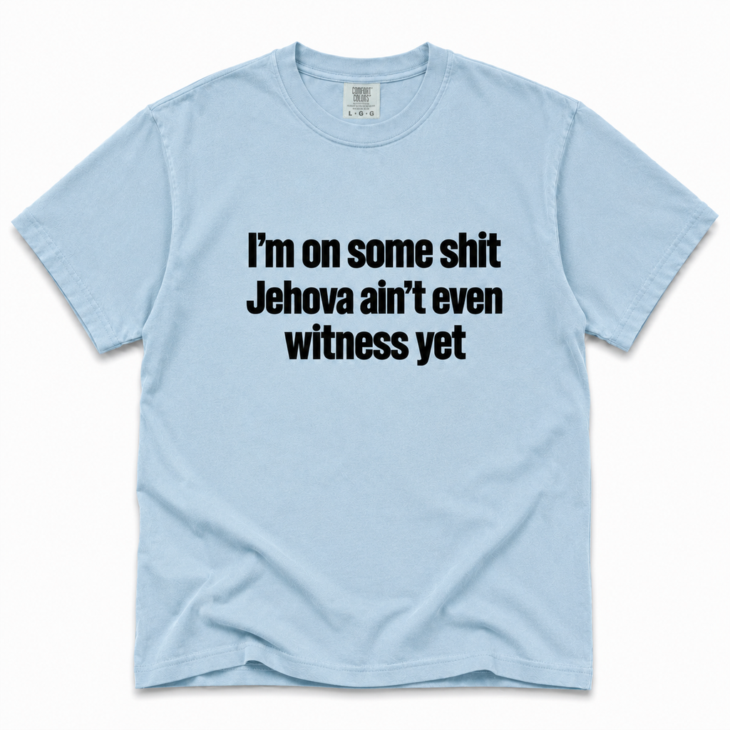 chambray crewneck t-shirt with the text 'I'm on some shit Jehova ain't even witness yet' printed in black across the chest, displayed flat against a white background.