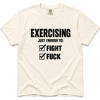 ivory crewneck t-shirt with a black graphic print that reads 'EXERCISING JUST ENOUGH TO: FIGHT FUCK' with checkmarks next to each word, displayed flat against a white background.
