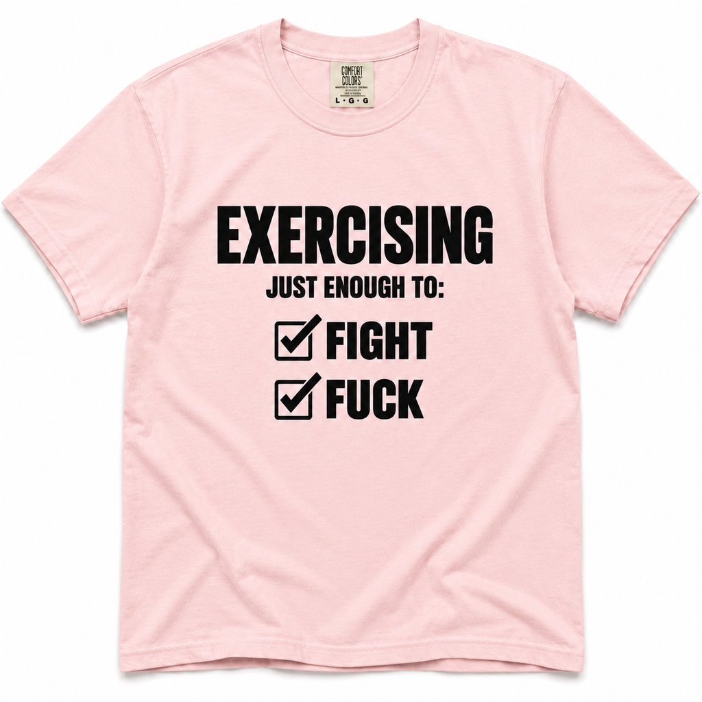 blossom crewneck t-shirt with black printed text on the front reading 'EXERCISING JUST ENOUGH TO: FIGHT' and 'FUCK' next to checkmarks. The shirt is laid flat against a white background.