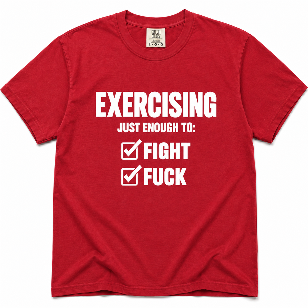 A red short-sleeve crewneck t-shirt with bold white text on the front reading 'EXERCISING JUST ENOUGH TO: FIGHT' and 'FUCK' next to checked boxes, displayed flat against a white background.