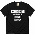 A black short-sleeve crewneck t-shirt with a white graphic print on the front that reads 'EXERCISING JUST ENOUGH TO: FIGHT' and 'FUCK' next to checkmarks, displayed on a clean white background.