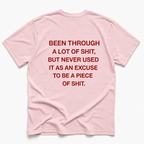 blossom short-sleeve t-shirt with bold red text printed on the back, laid flat against a clean white background.