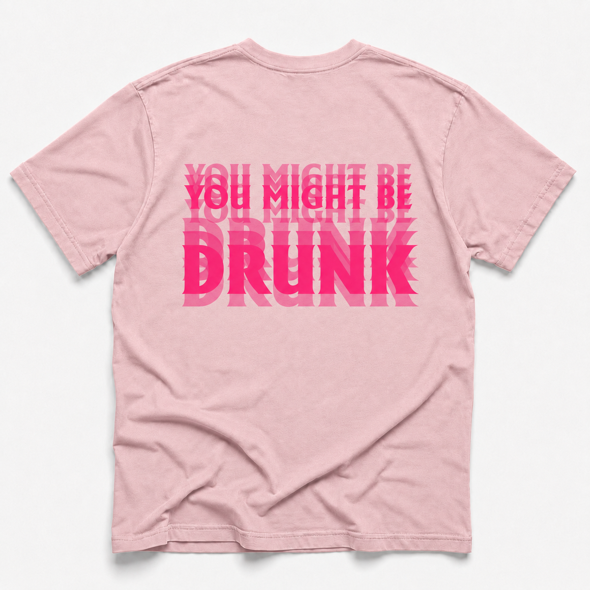 blossom short-sleeve t-shirt shown from the back, featuring a bold graphic text design in bright pink that reads 'YOU MIGHT BE DRUNK' with a repeating geometric pattern.