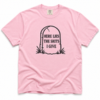 blossom short-sleeve crewneck t-shirt with a black graphic of a tombstone on the chest containing the text 'HERE LIES THE SHITS I GIVE'.