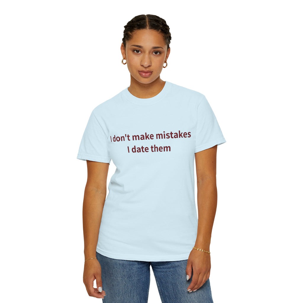 Female model wearing a Chambray crewneck T-shirt with dark text reading “I Don’t Make Mistakes, I Date Them” on the front, paired with blue jeans on a white background