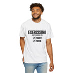 Male model wearing a white “Exercising Just Enough To: Fight, Fuck” graphic T-shirt with checked boxes on the front.